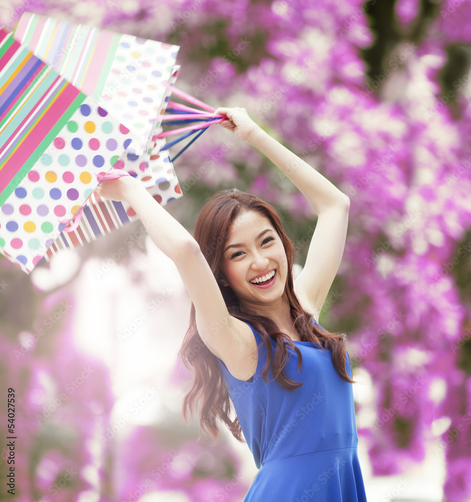 Smiling girl with shopping bags