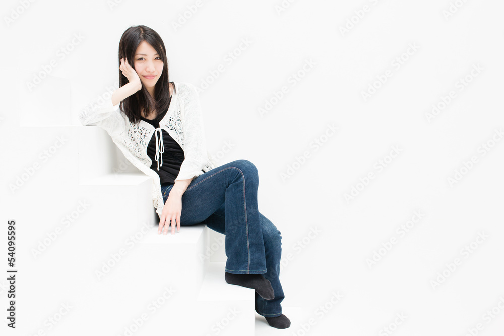 attractive asian woman relaxing on stair