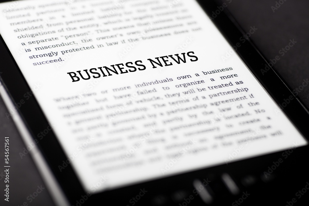 Business news on tablet touchpad, ebook concept