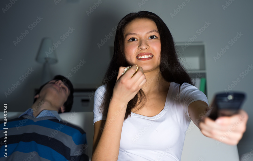 woman watching television at home