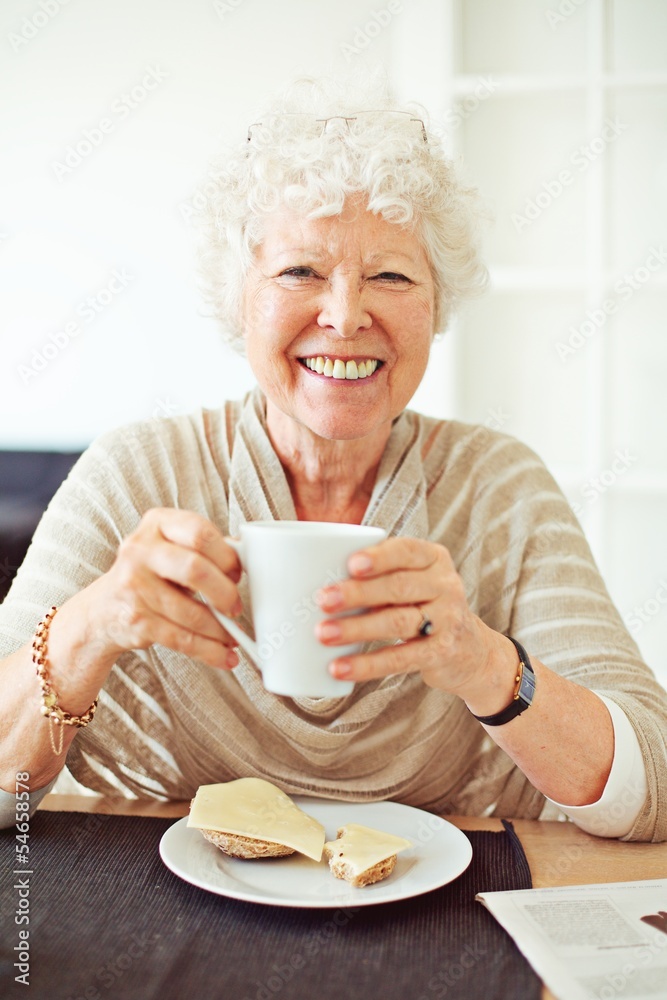 Smiling Senior Woman Having Her Breakfast