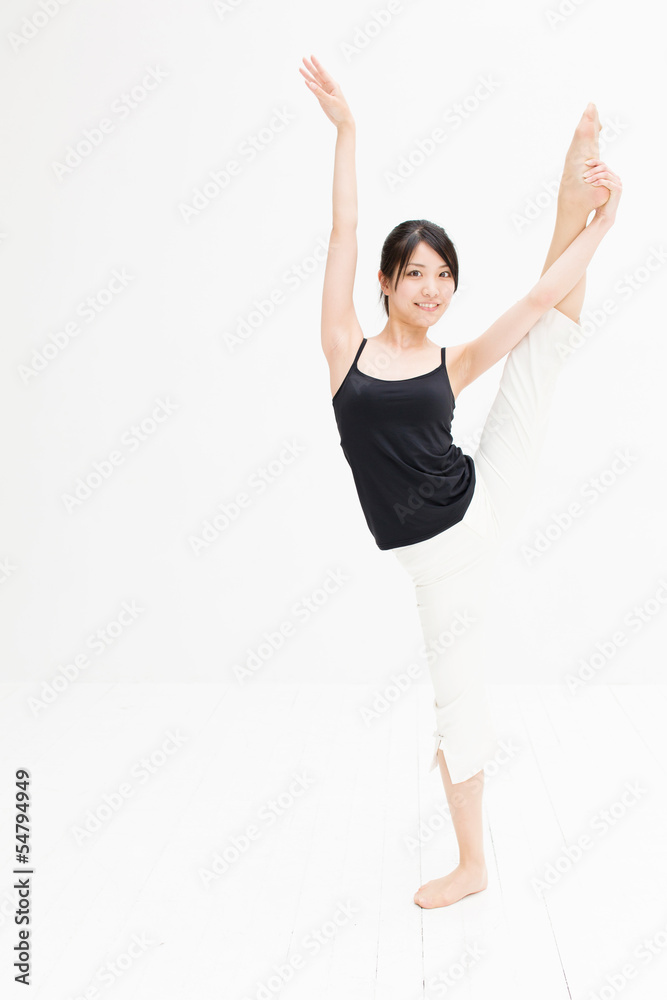 attractive asian woman exercising on white background