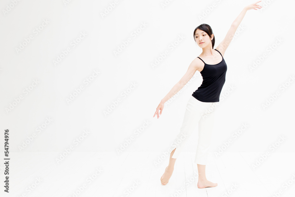 attractive asian woman exercising on white background