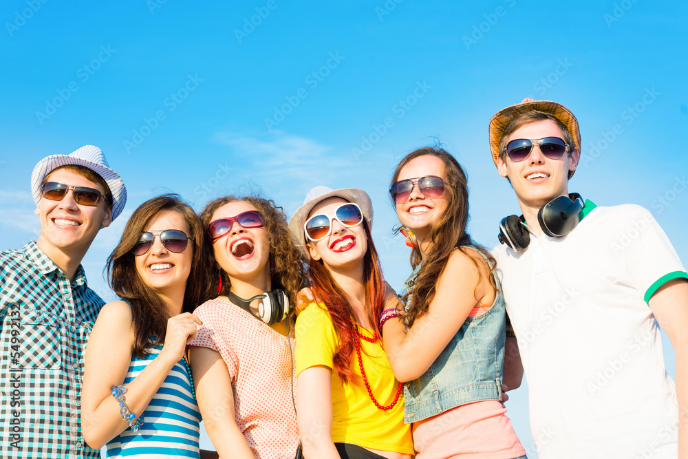 group of young people wearing sunglasses and hat