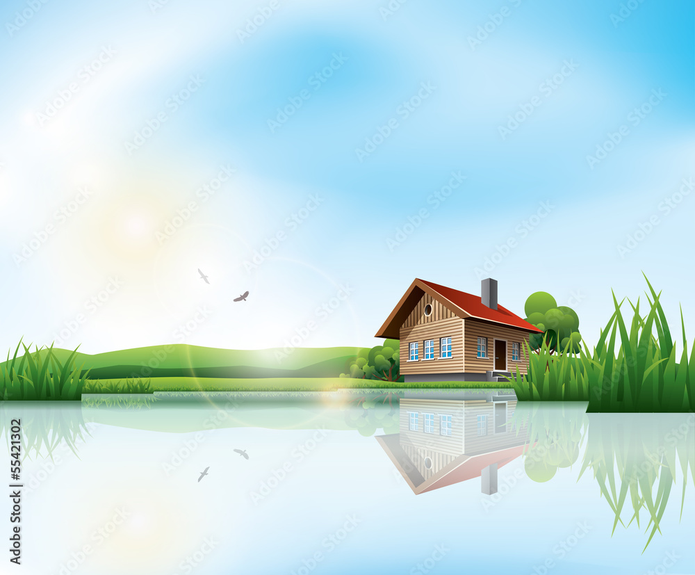 Beautiful sunny landscape with house and a lake