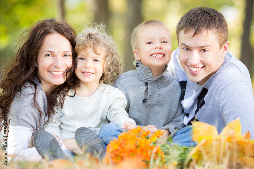 Happy family in autumn park