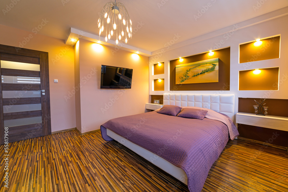 Modern brown and beige master bedroom interior