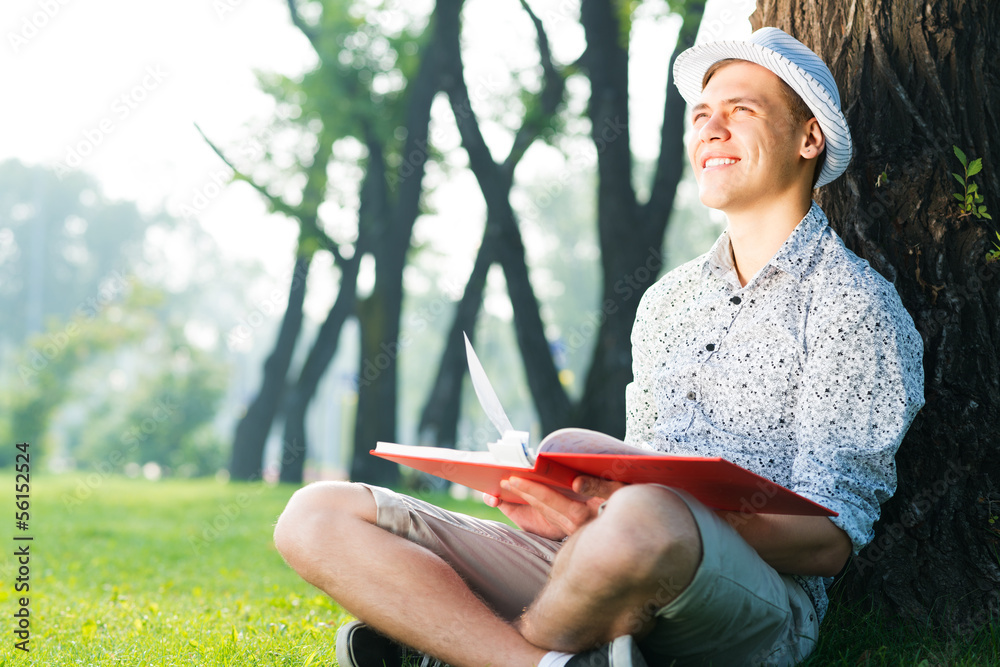 young man reading a book