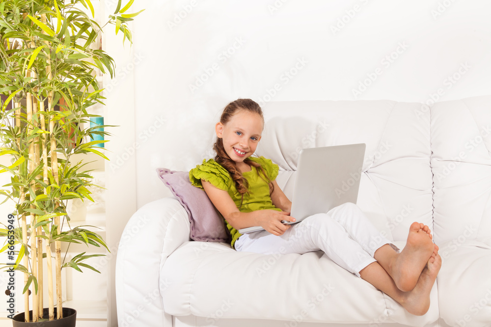 Smiling girl with laptop