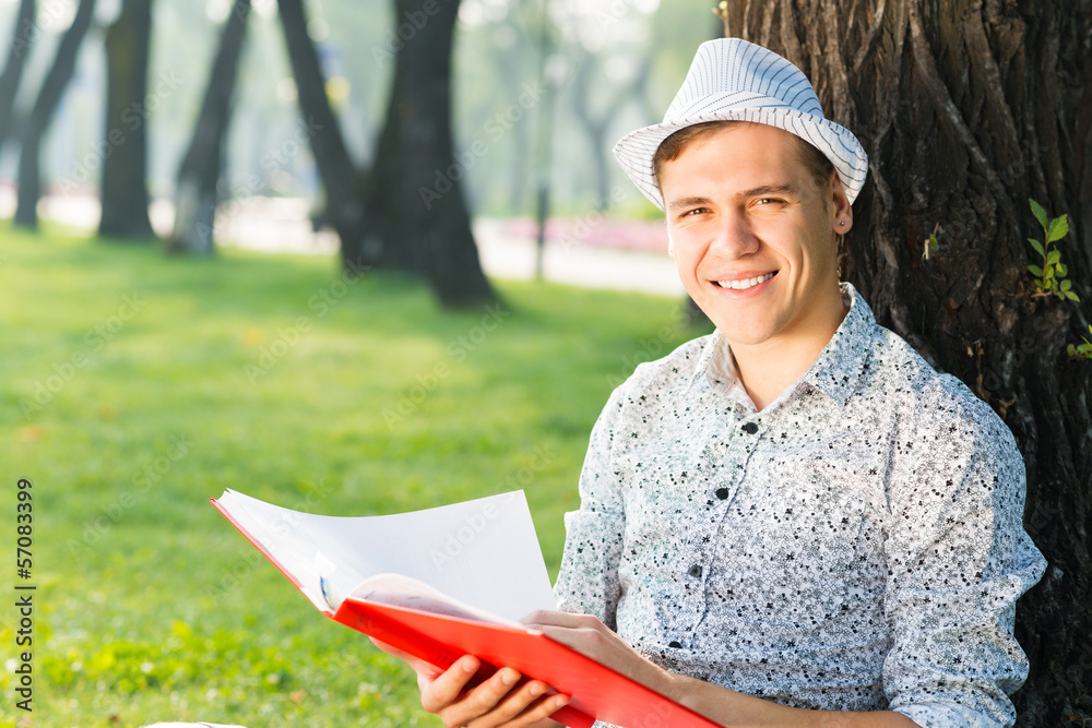 young man reading a book