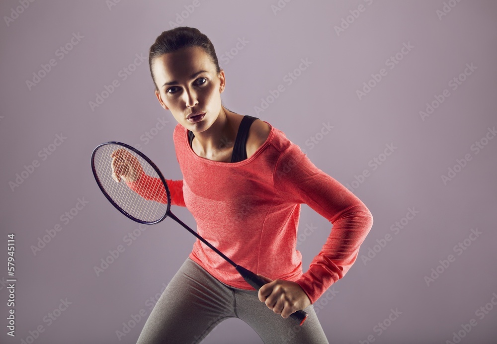 Beautiful girl playing badminton