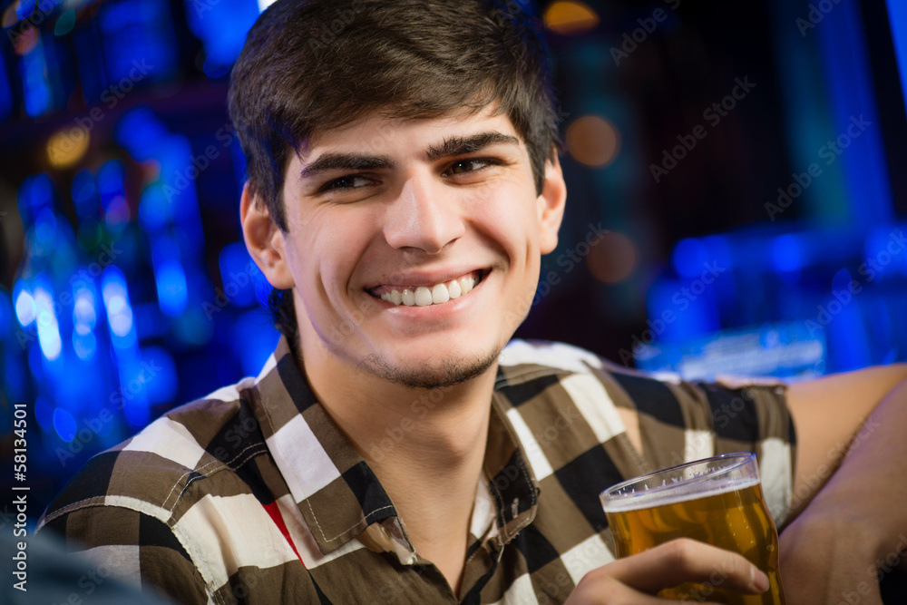 portrait of a young man at the bar