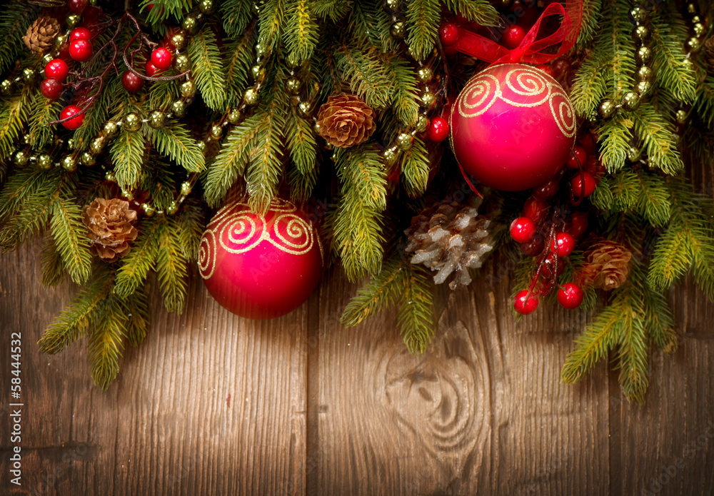 Christmas Tree and Decorations Over Wooden Background