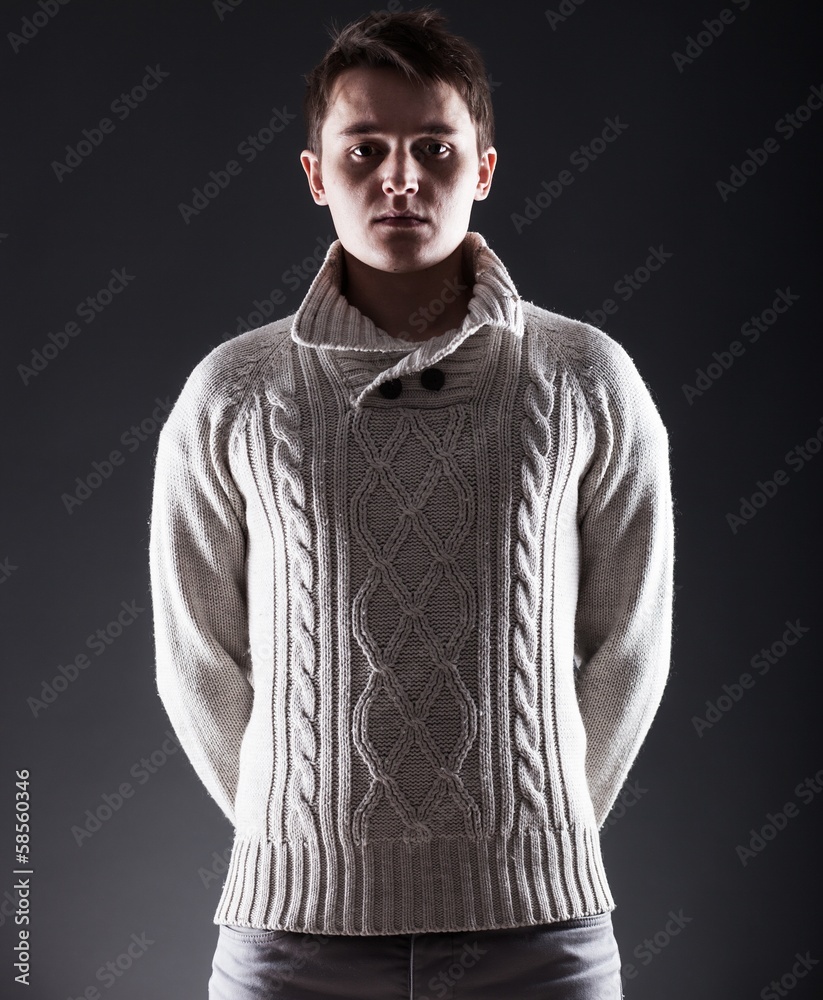 Young man in white sweater