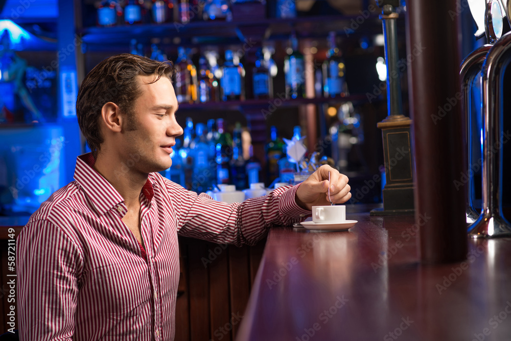 man with a cup of coffee