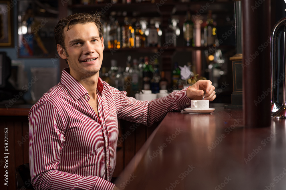 man with a cup of coffee