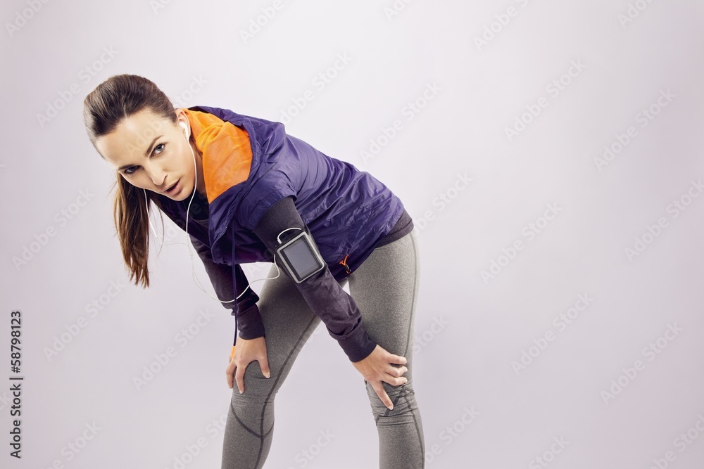 Female athlete looking tired after a run