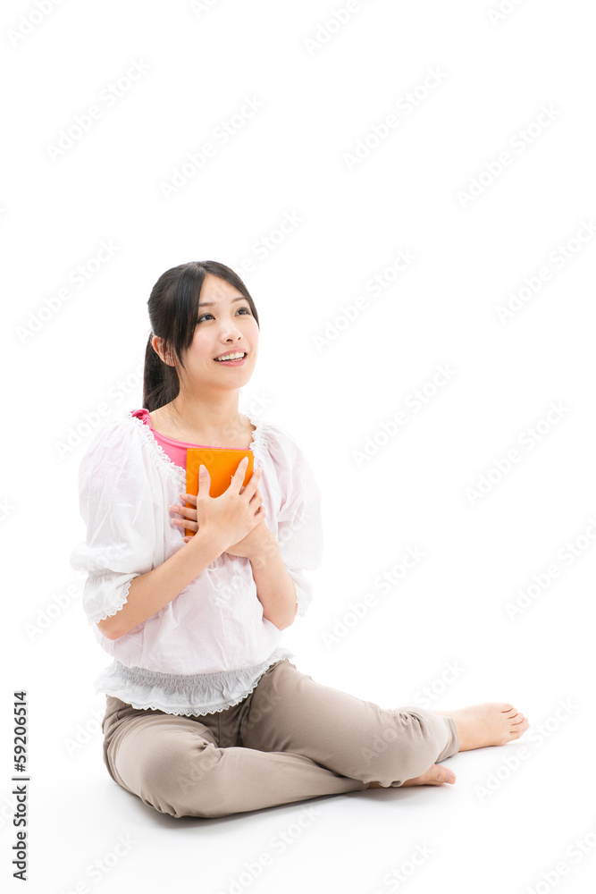 young asian woman reading book on white background