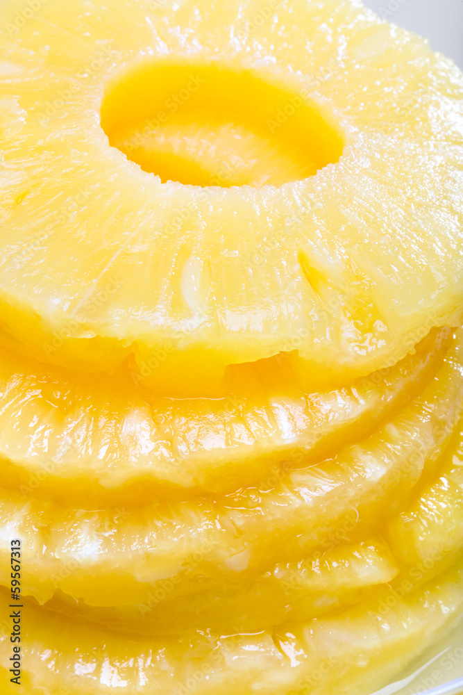 Sliced pineapple. Canned fruits. Macro