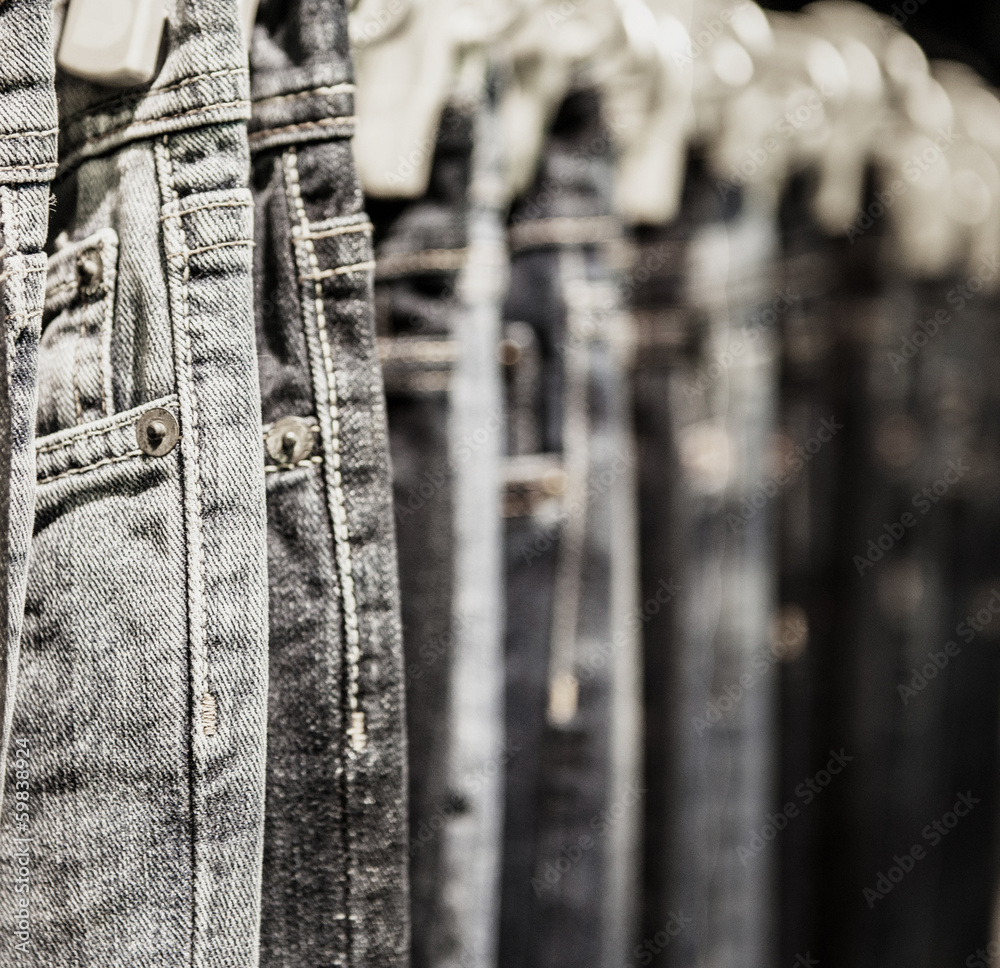 Garment rack with classic Jeans close up shot