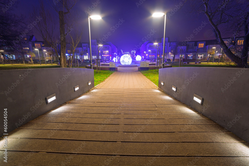 Park pathway in Pruszcz Gdanski at night, Poland