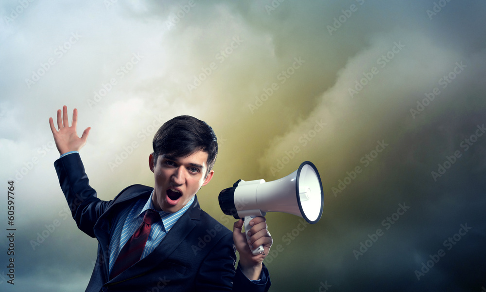 businessman shouting into a megaphone