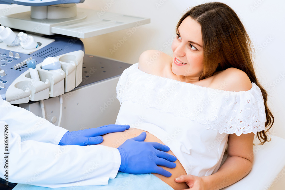 pregnant woman on reception at the doctor