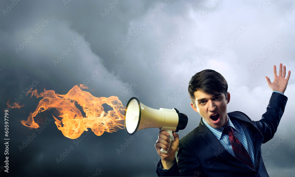 businessman shouting into a megaphone