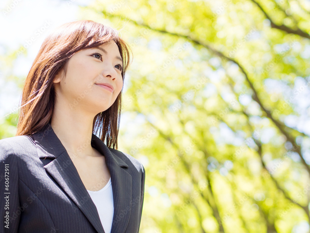 young asisn businesswoman in the park