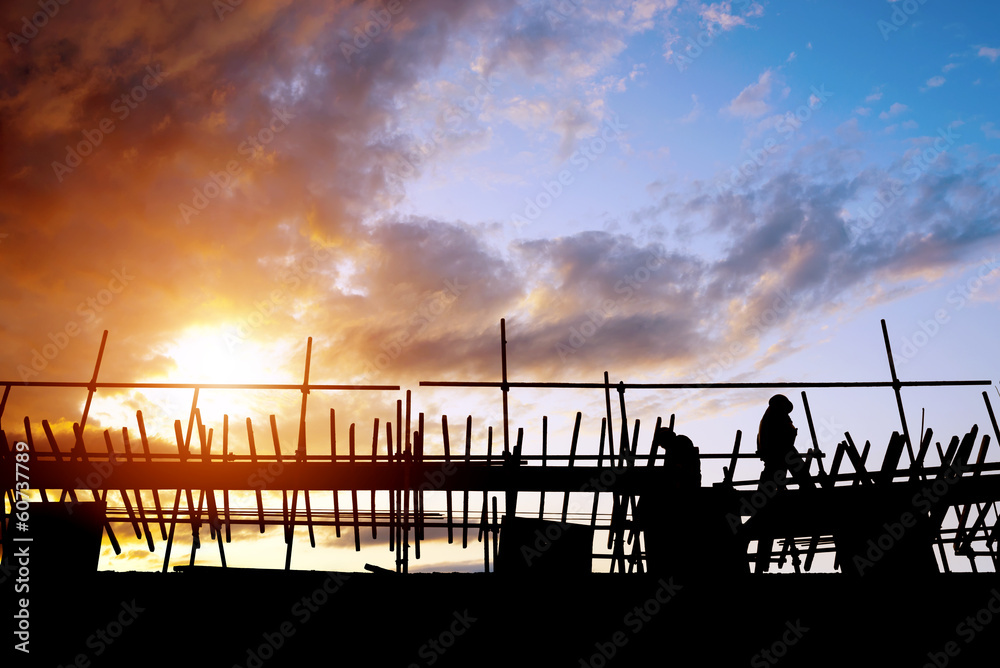 Construction workers on scaffolding