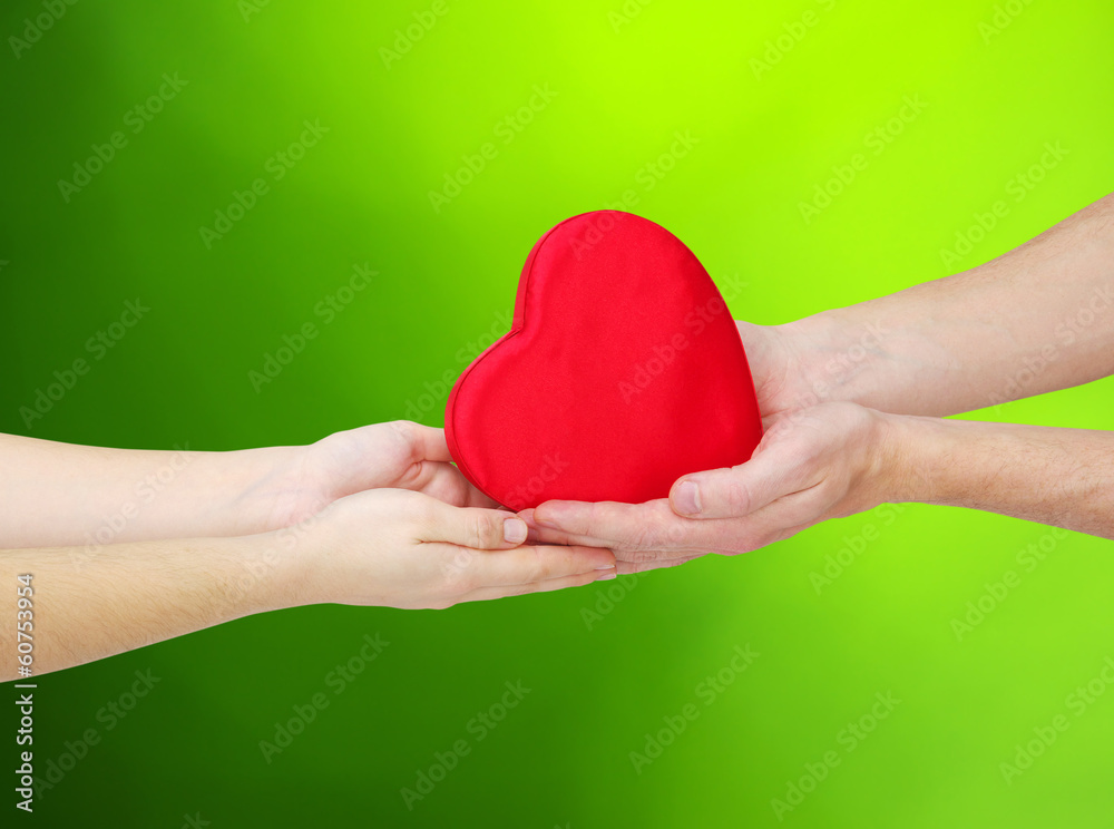 Red heart in hands