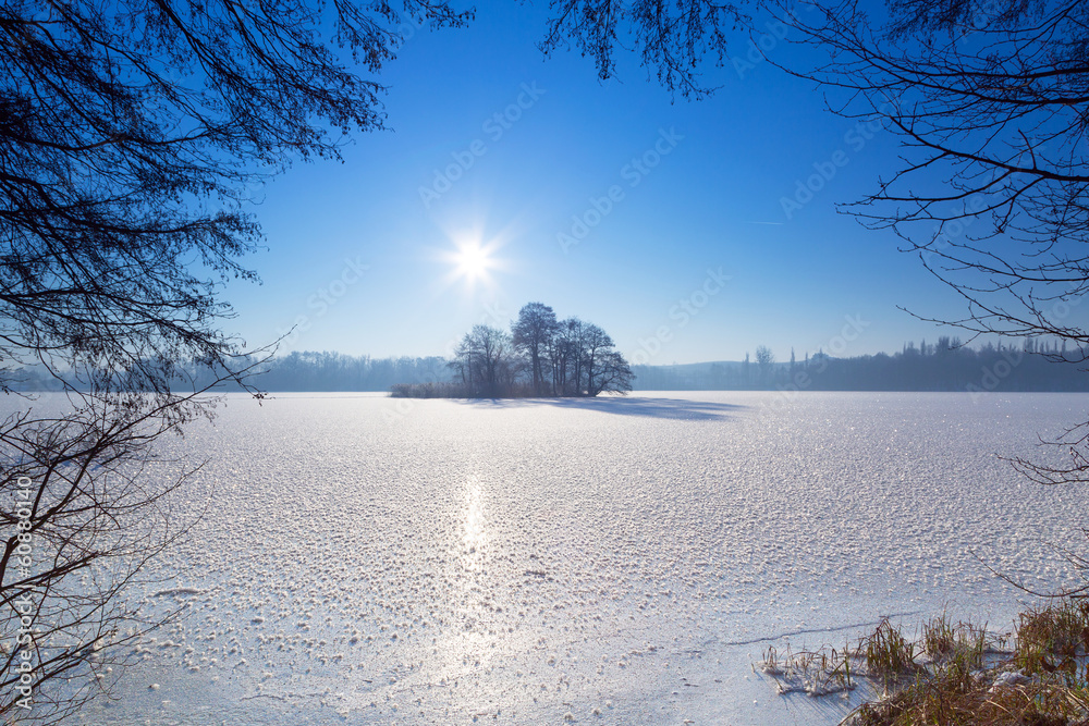 Winter scenery of frozen lake in Poland