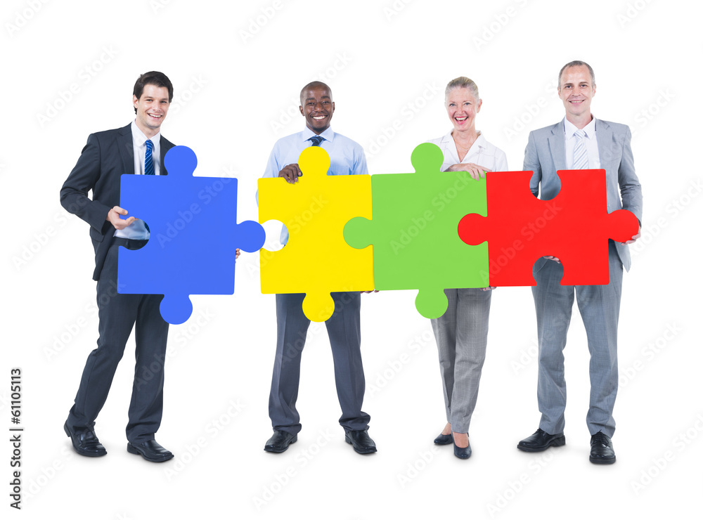 Group of Business People Building Jigsaw