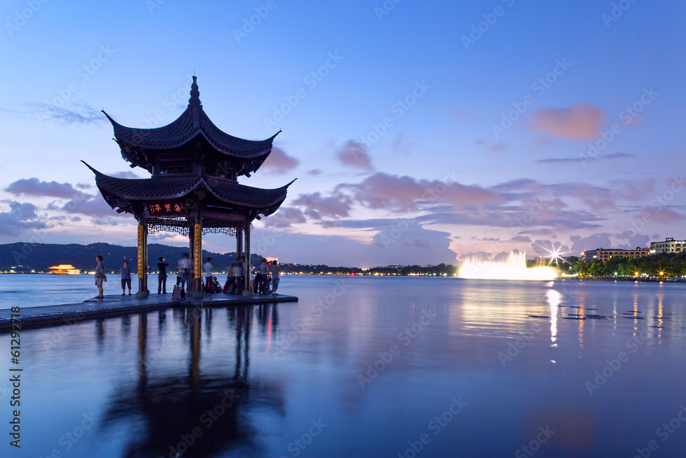 pavilion at nightfall in west lake ，hangzhou ，China