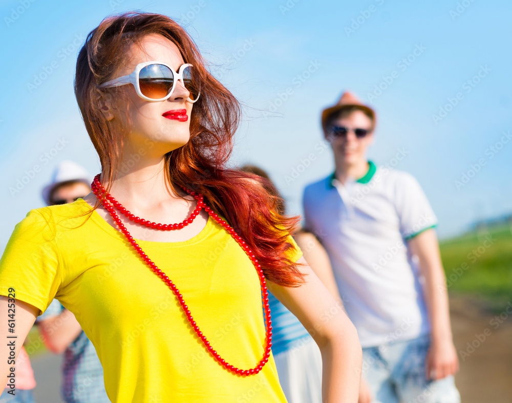 stylish young woman in sunglasses