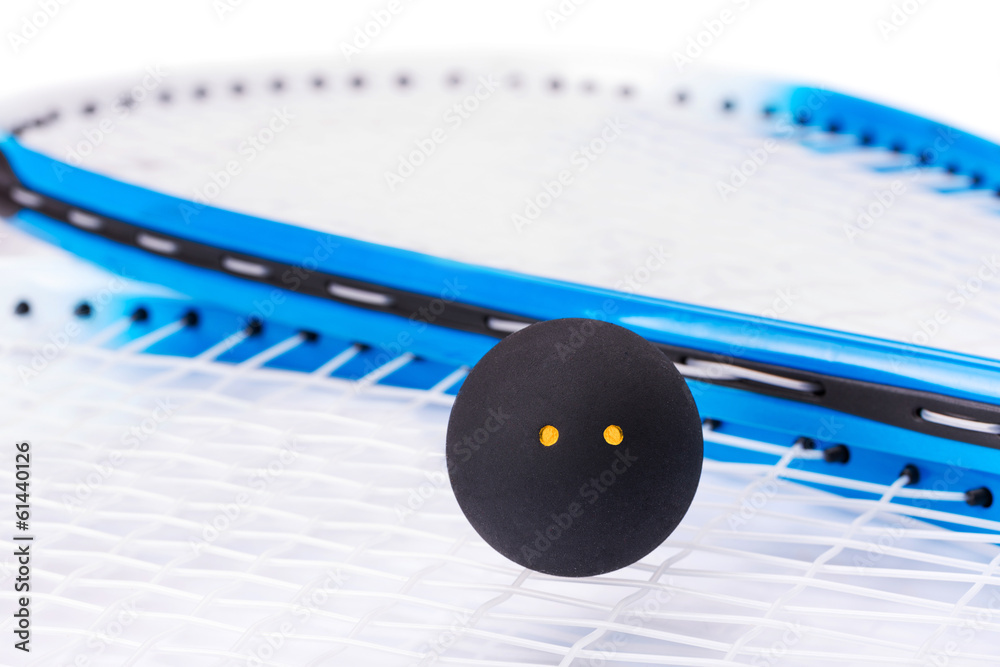 Close up of a squash rackets and ball