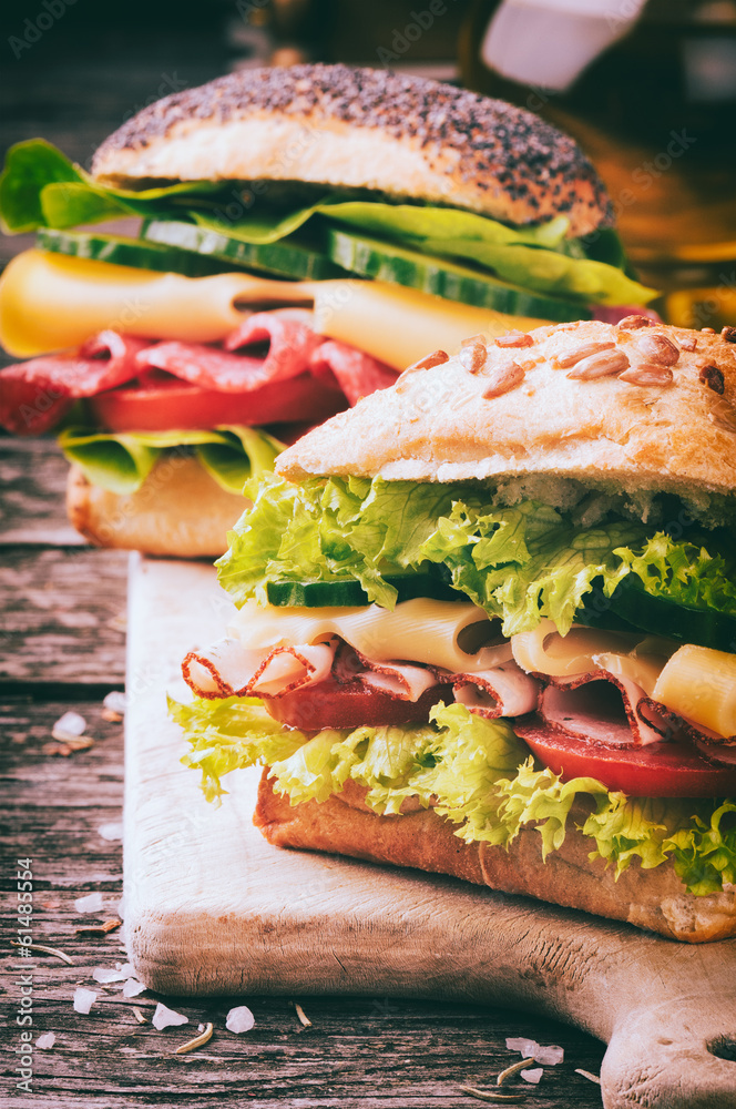 Fresh sandwiches on cutting board