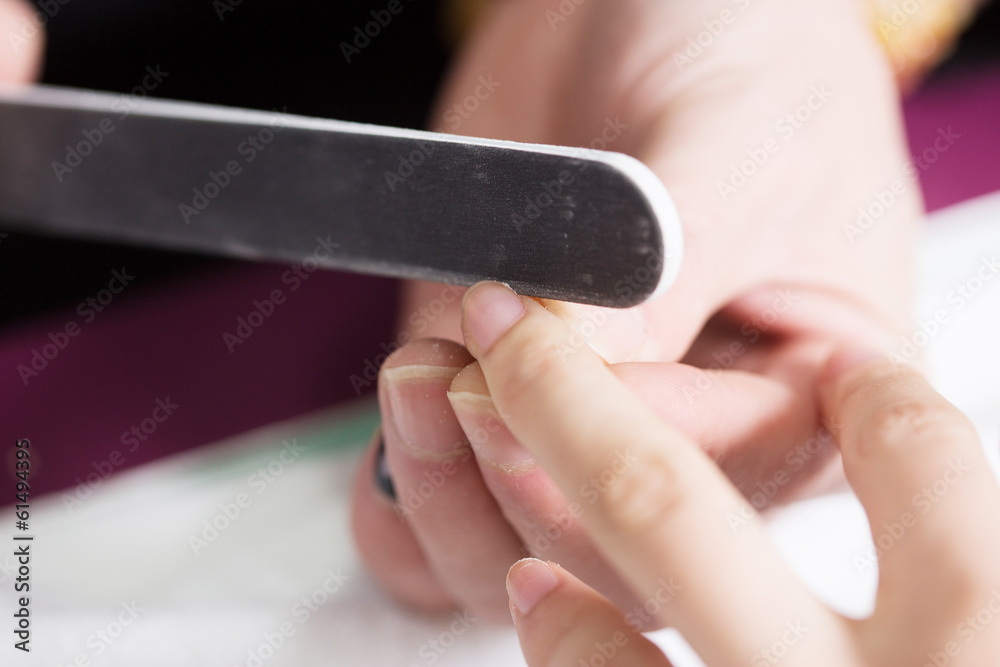 Manicure process in beauty salon, close up