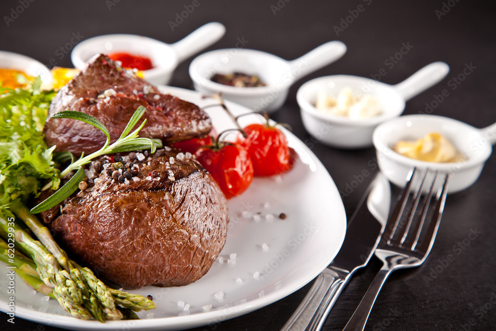 Fresh beef steak on black stone