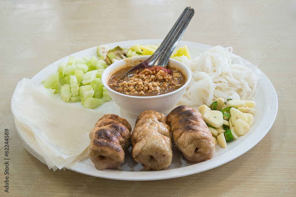 vietnamese cuisine , roasted pork served with spicy sauce and ve