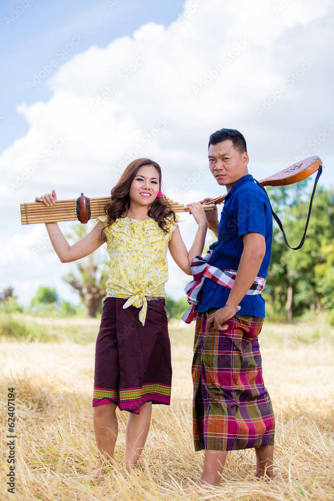 Thai costume and ancient musical instrument