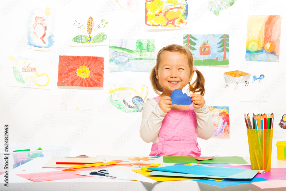 Little girl with paper cloud