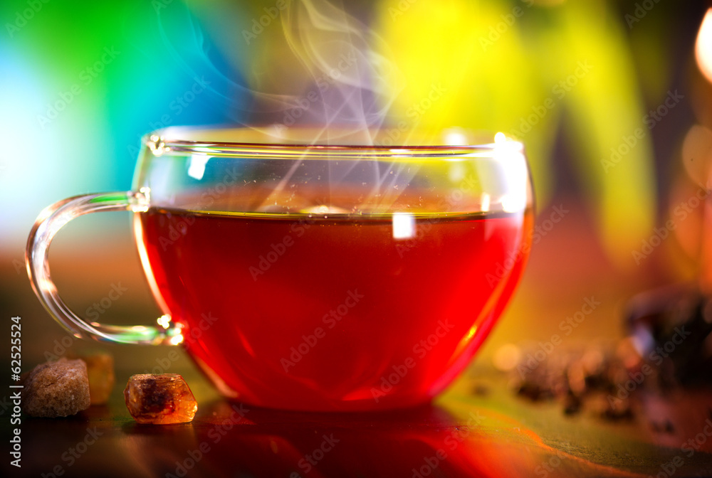 Cup of Healthy Tea over Nature Green background. Herbal Tea