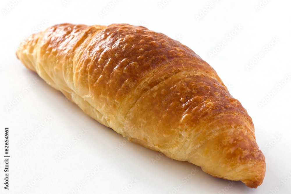 Single croissant on white surface