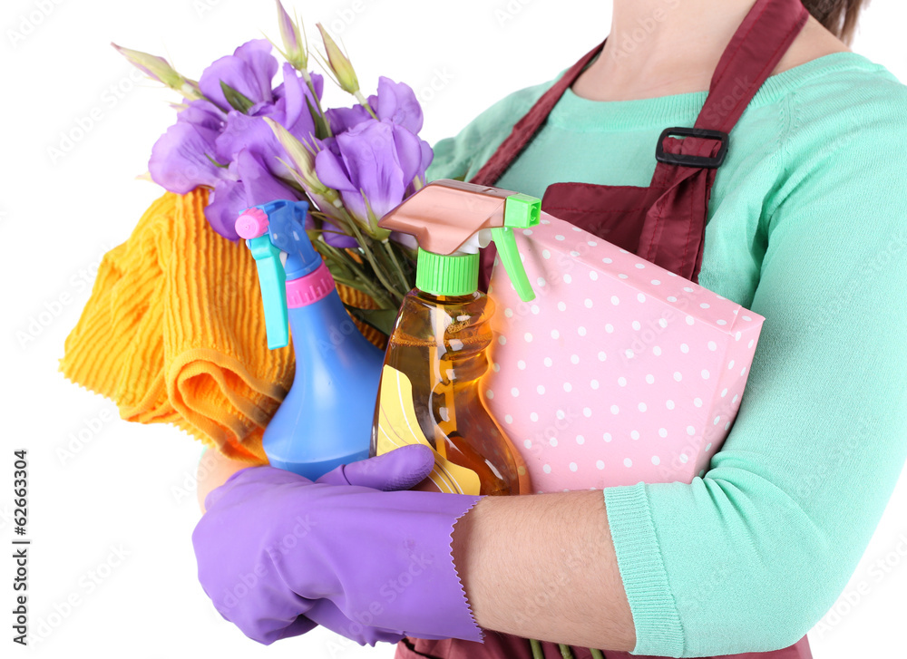 Housewife holding cleaning equipment in her hands. Conceptual