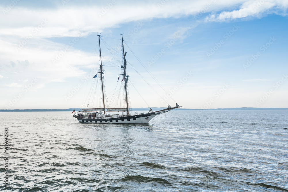 Tall ship on blue water horizontal