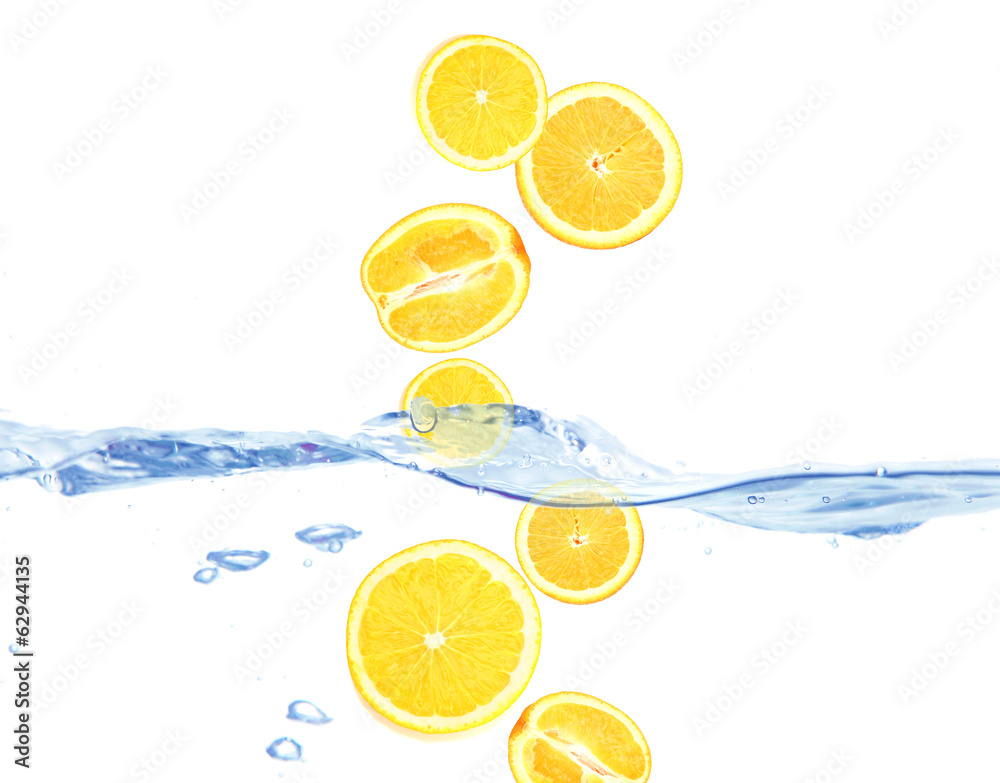 Juicy orange dropped into water