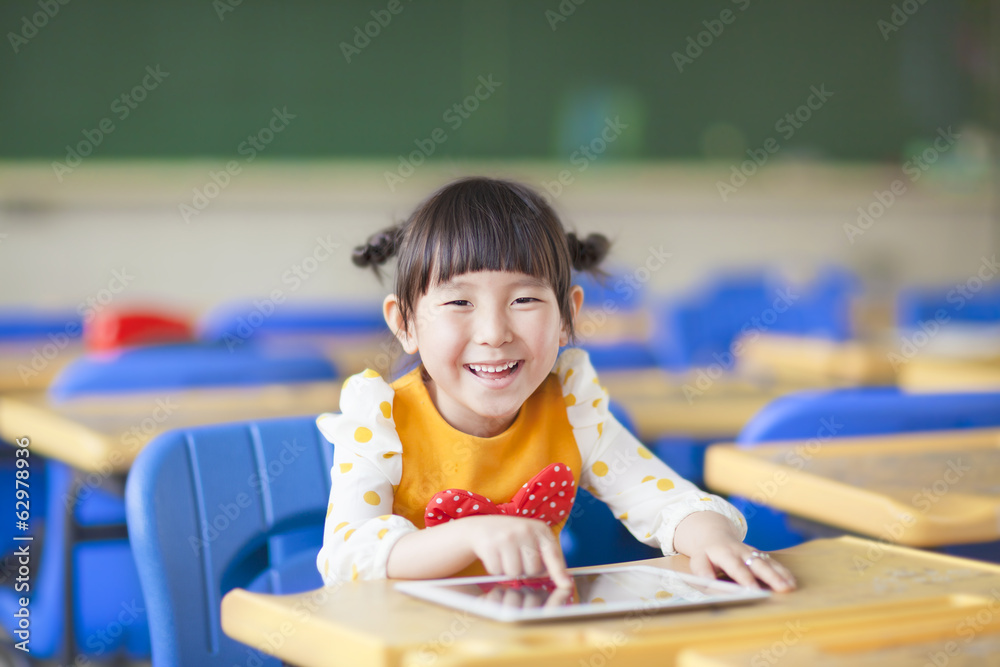 smiling kid using tablet  or ipad