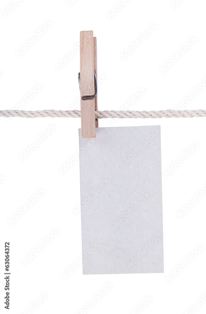 Paper or cardboard background, with clothes pegs