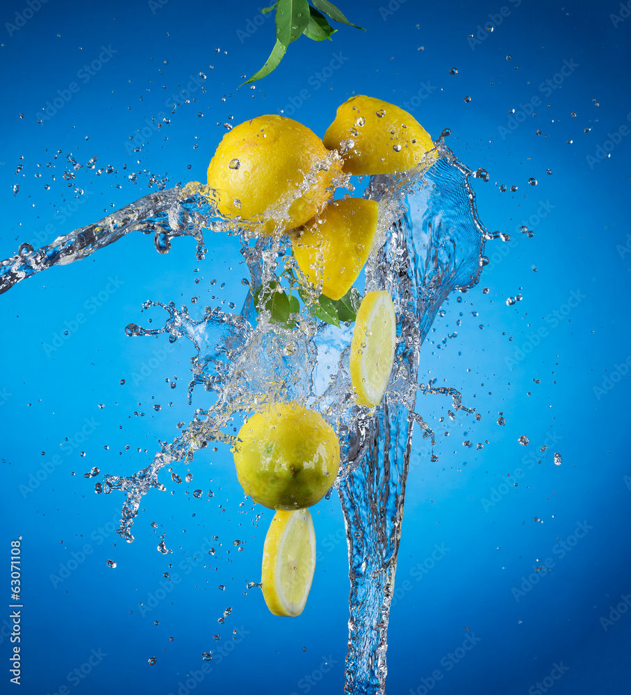 Pieces of lemons in water splash